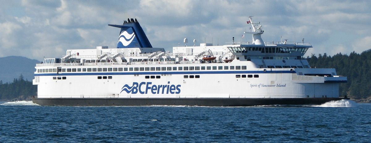 BC Ferries design Spirit of Vancouver Island sailing past BC coast with trees and mountains in background