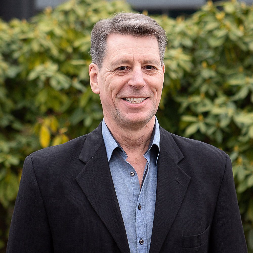 Mark Cook, COO/Vice President Vancouver Vard Marine in black blazer and blue shirt